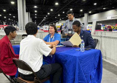 Tammy, Na'Im, Dan interviewing competitors